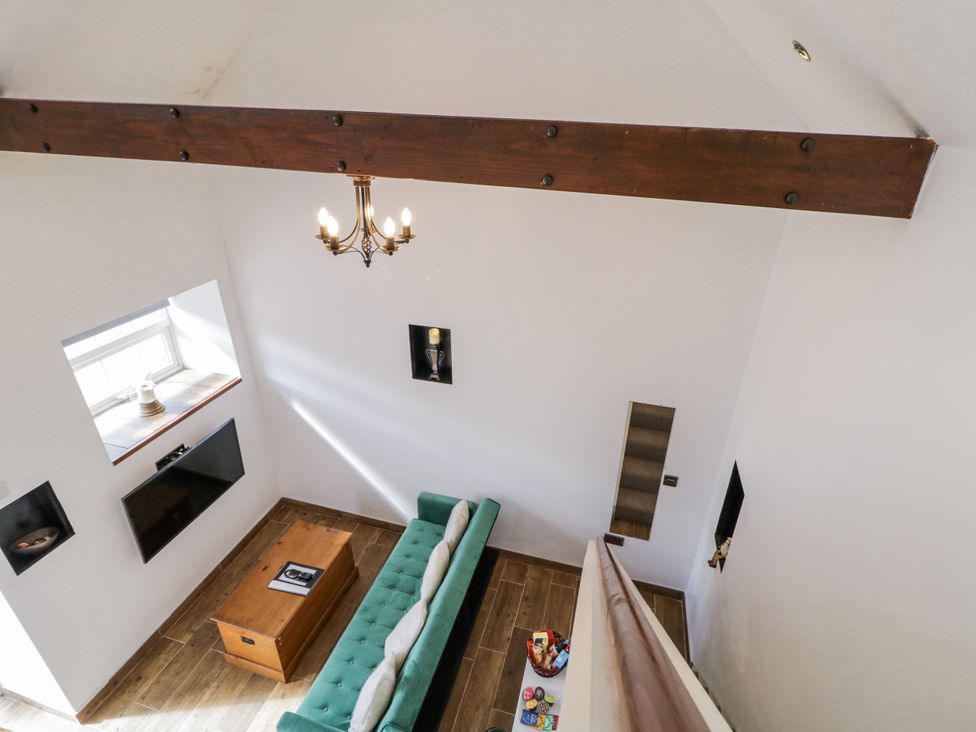 A living room with a sofa and coffee table at Derrywilligan 1,2,3 in Newry