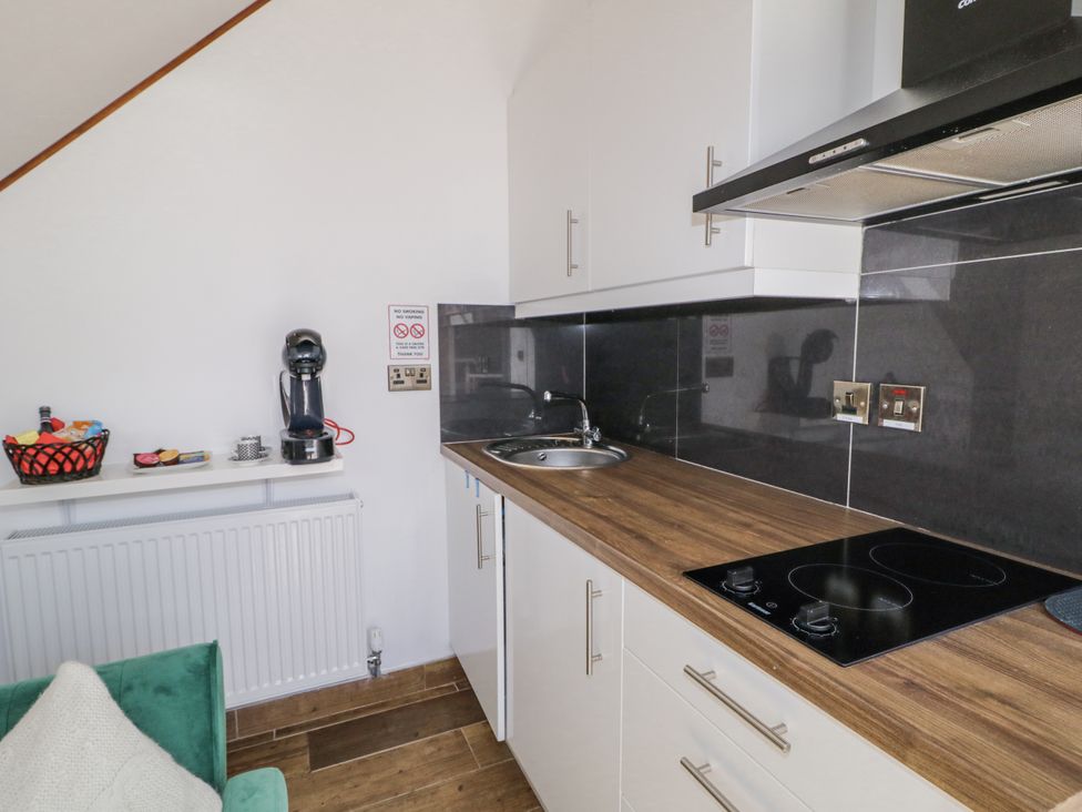 A kitchen with a sink and stove at Derrywilligan 1,2,3 in Newry