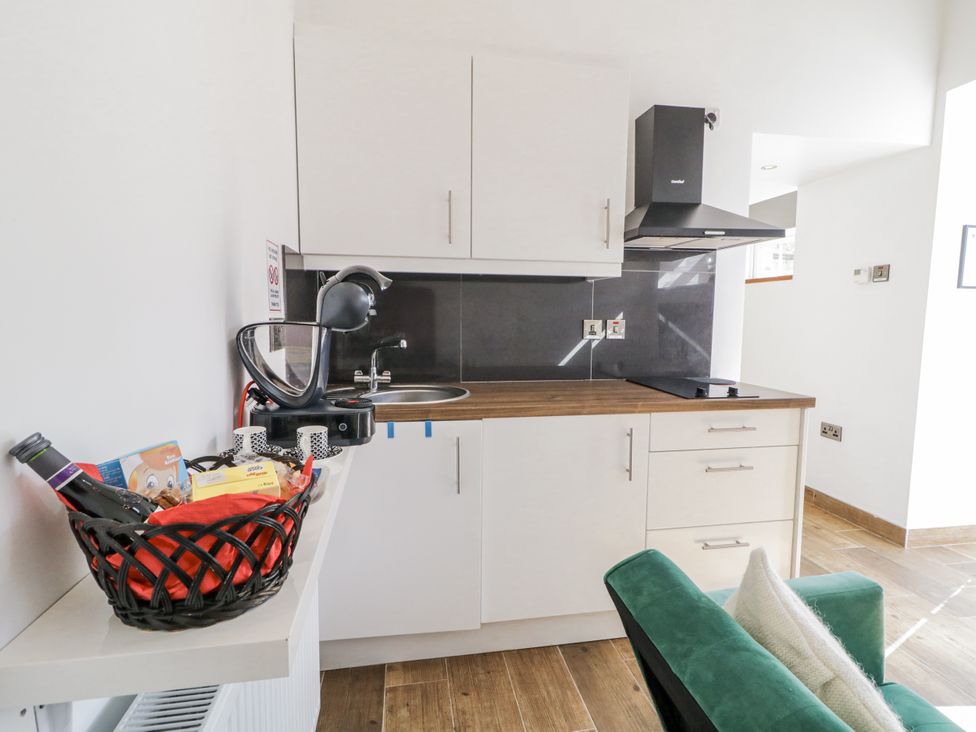 A kitchen with sink and cabinets at Derrywilligan 1,2,3 in Newry