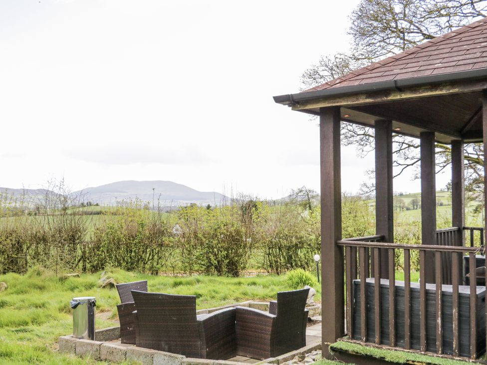 An outdoor seating area with views of mountains at Derrywilligan 1,2,3 in Newry