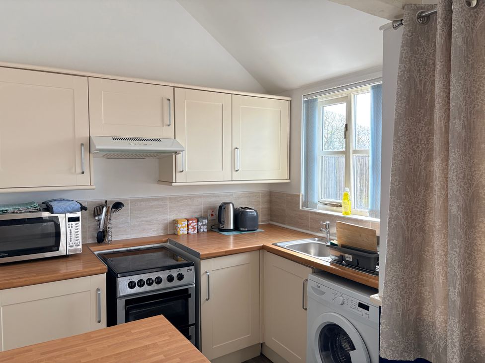 A kitchen with countertop and appliances at Lighthouse Cottage in St Erme near Truro