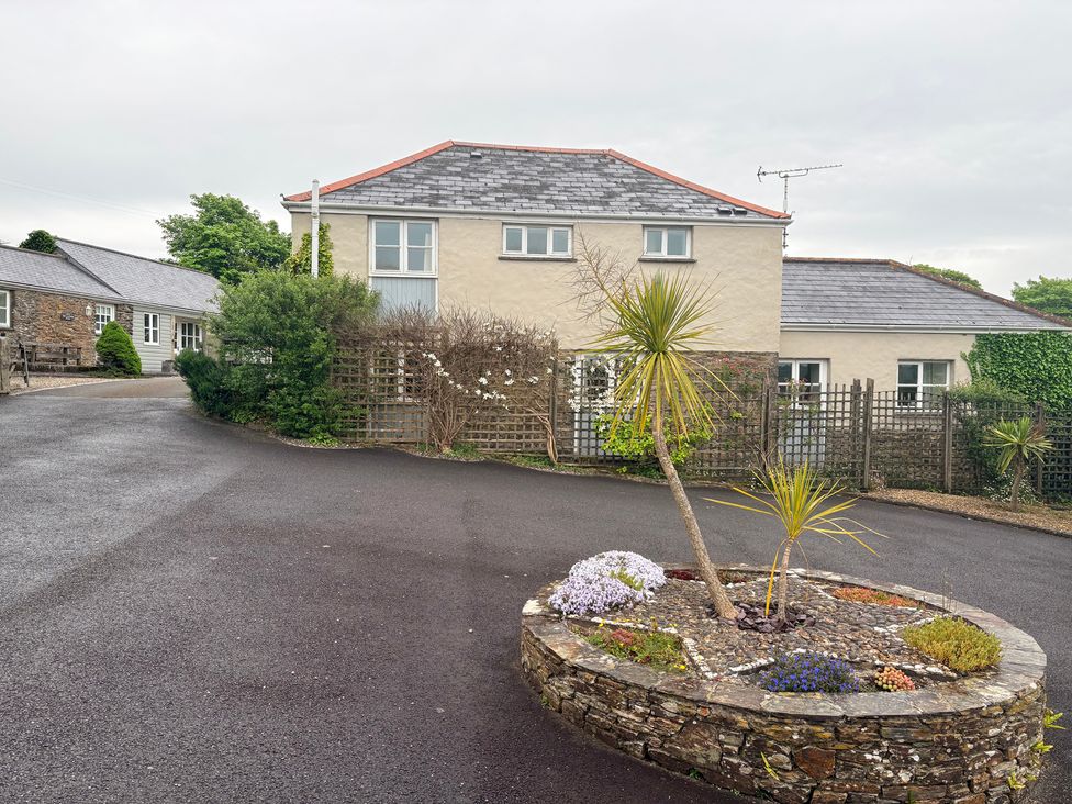 A house with a garden and paving at Sunlight Cottage St Erme near Truro