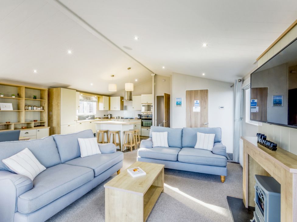 A living room with a sofa and coffee table at Lodge 62 at Riviera Bay Coastal Retreat Brixham