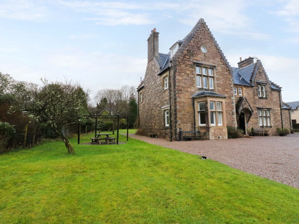 A house with a garden and gazebo at Rudha Na Craig Inveraray