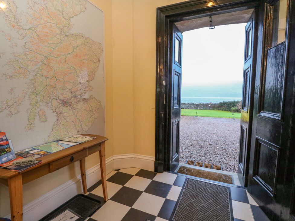 An entrance hall with a map and brochures at Rudha Na Craig in Inveraray