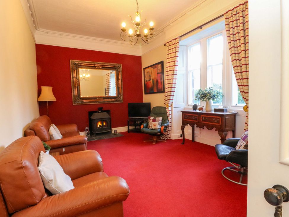 A living room with a sofa and television at Rudha Na Craig in Inveraray