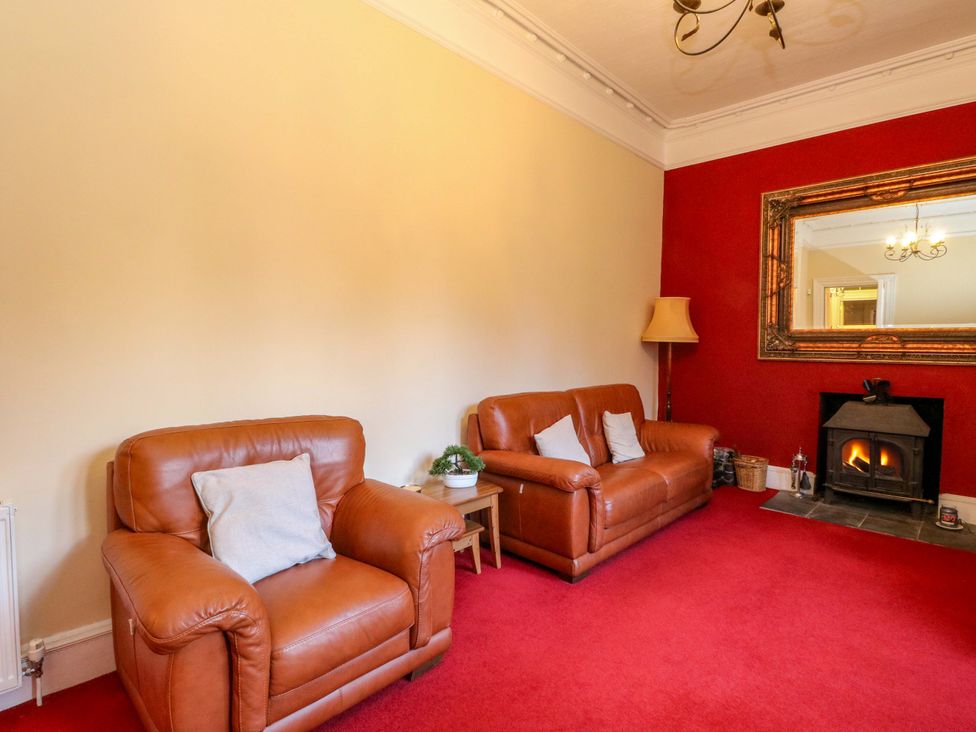 A living room with two sofas and a fireplace at Rudha Na Craig in Inveraray