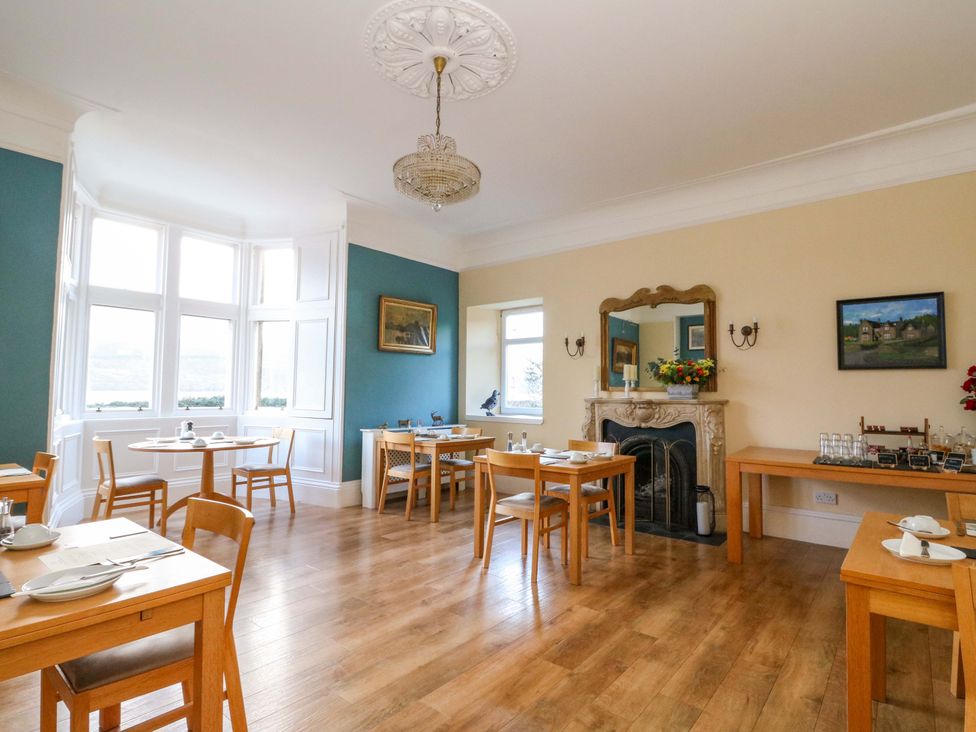 A dining room with tables and chairs at Rudha Na Craig in Inveraray