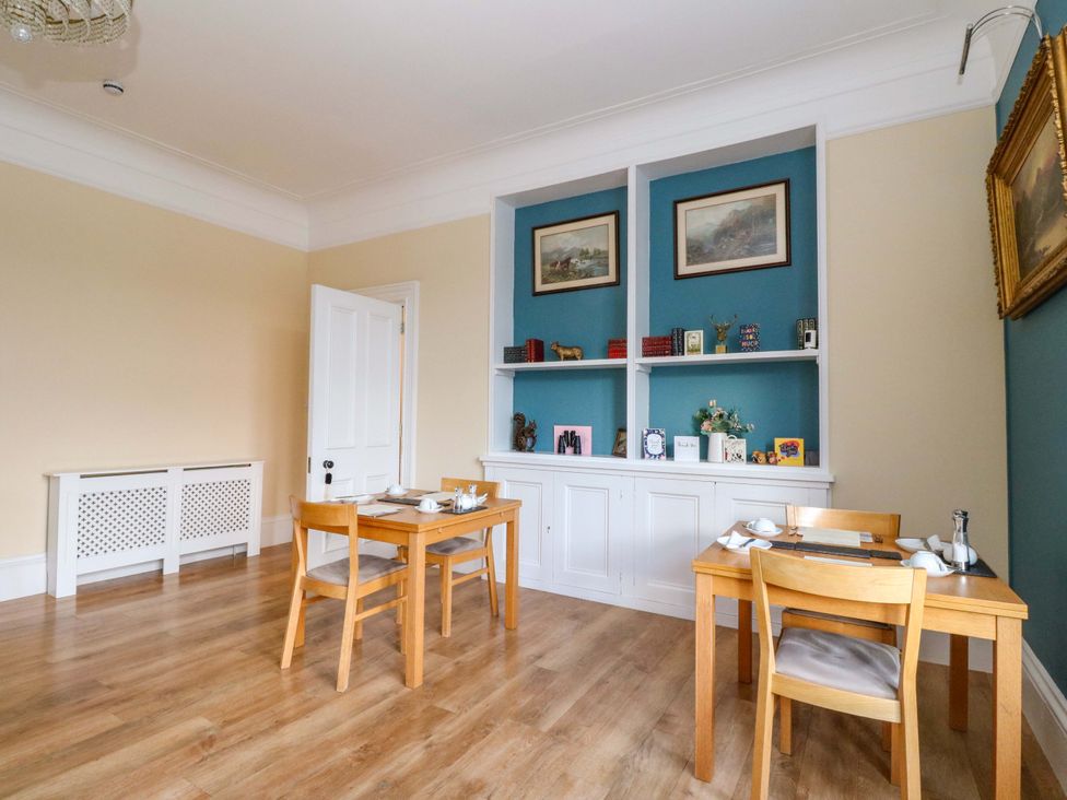 A dining room with tables and shelves at Rudha Na Craig in Inveraray