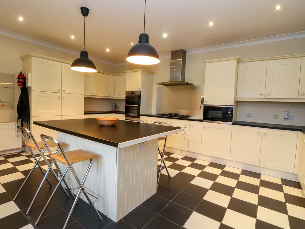 A kitchen with an island and appliances at Rudha Na Craig in Inveraray