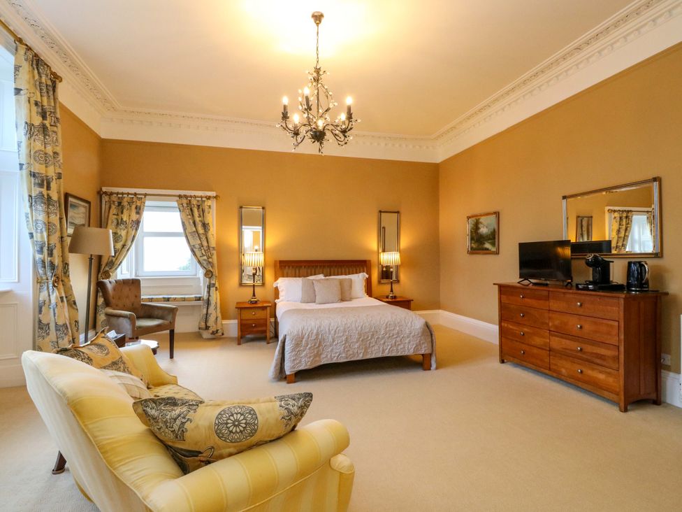 A bedroom with a bed and television at Rudha Na Craig in Inveraray