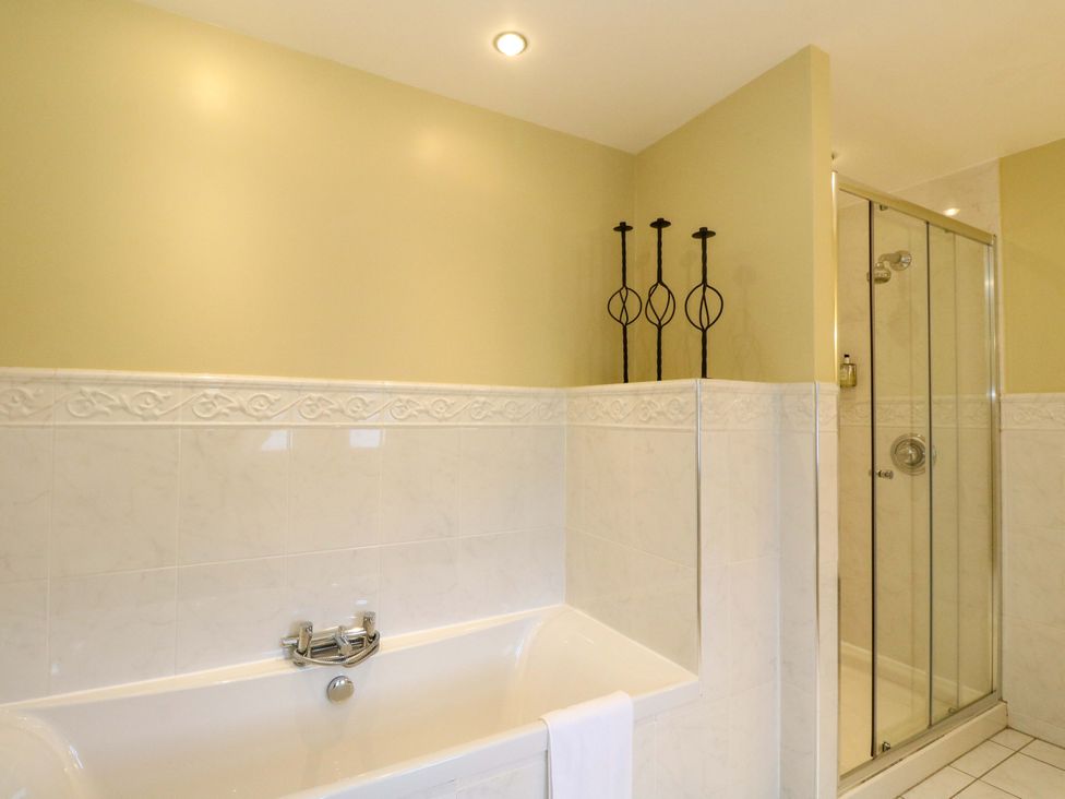 A bathroom featuring a bathtub and shower at Rudha Na Craig in Inveraray