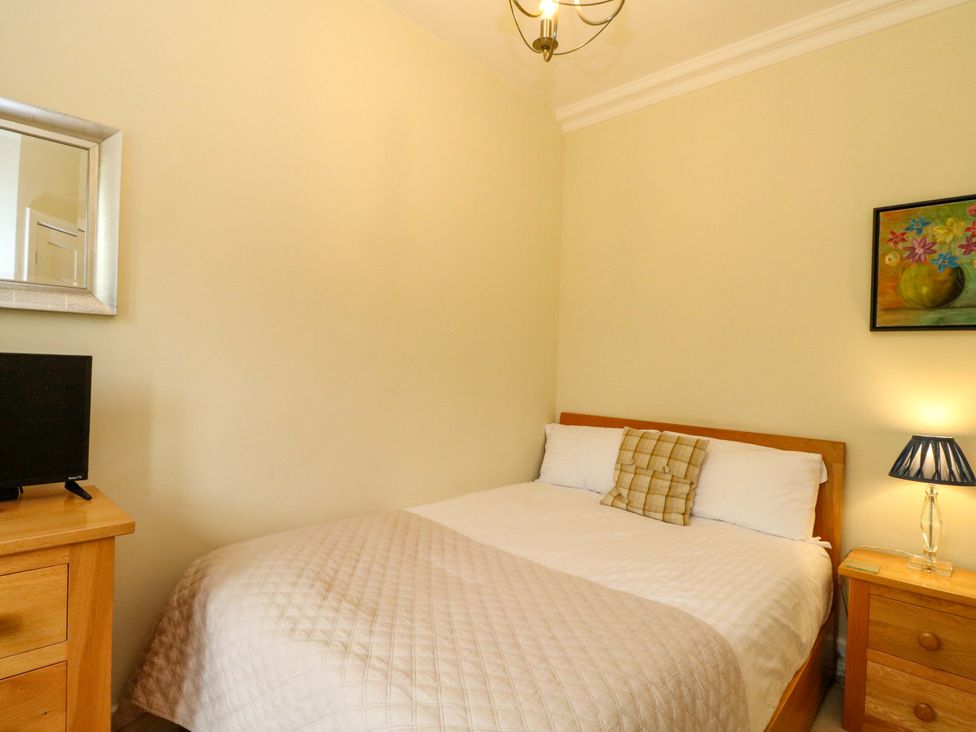 A bedroom with a bed and television at Rudha Na Craig in Inveraray