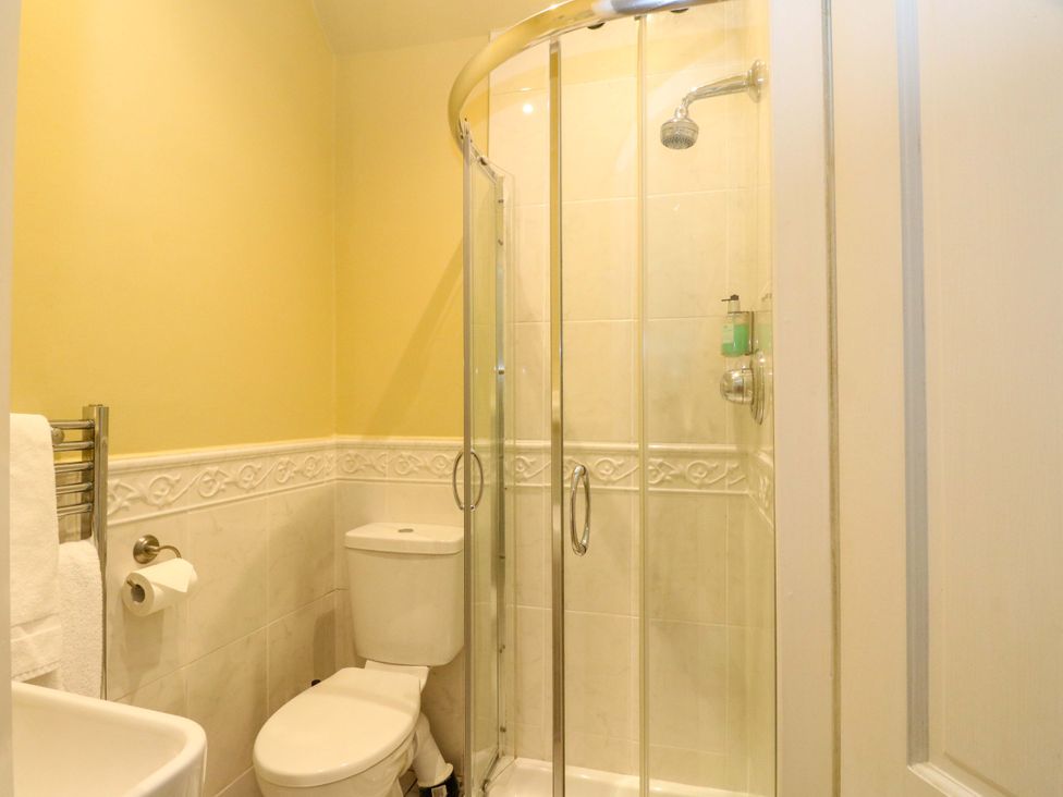 A bathroom with a shower, toilet, and sink at Rudha Na Craig Inveraray