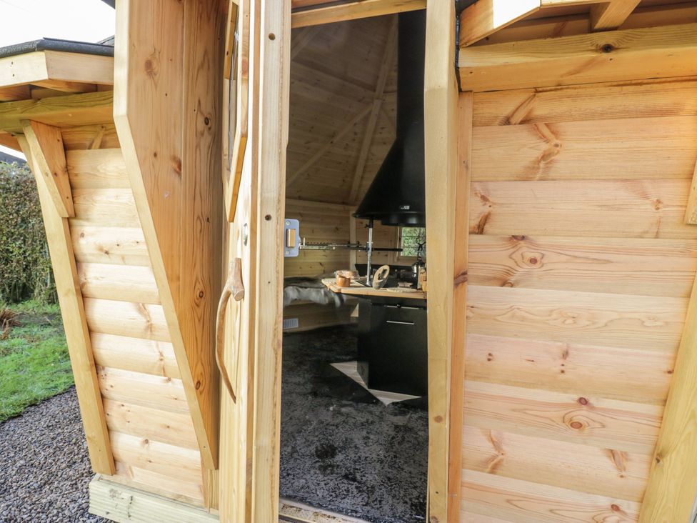 A wooden structure with a kitchen area visible at 1 Gilpin House Levens
