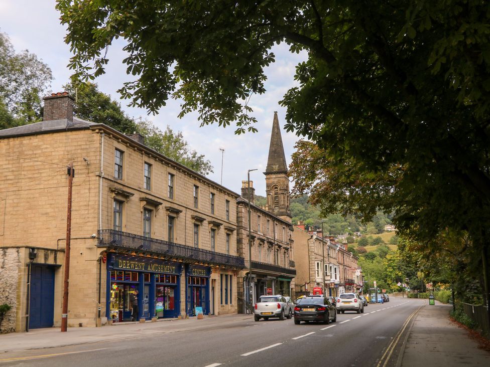 A street view with shops and cars at Roseville in Cromford
