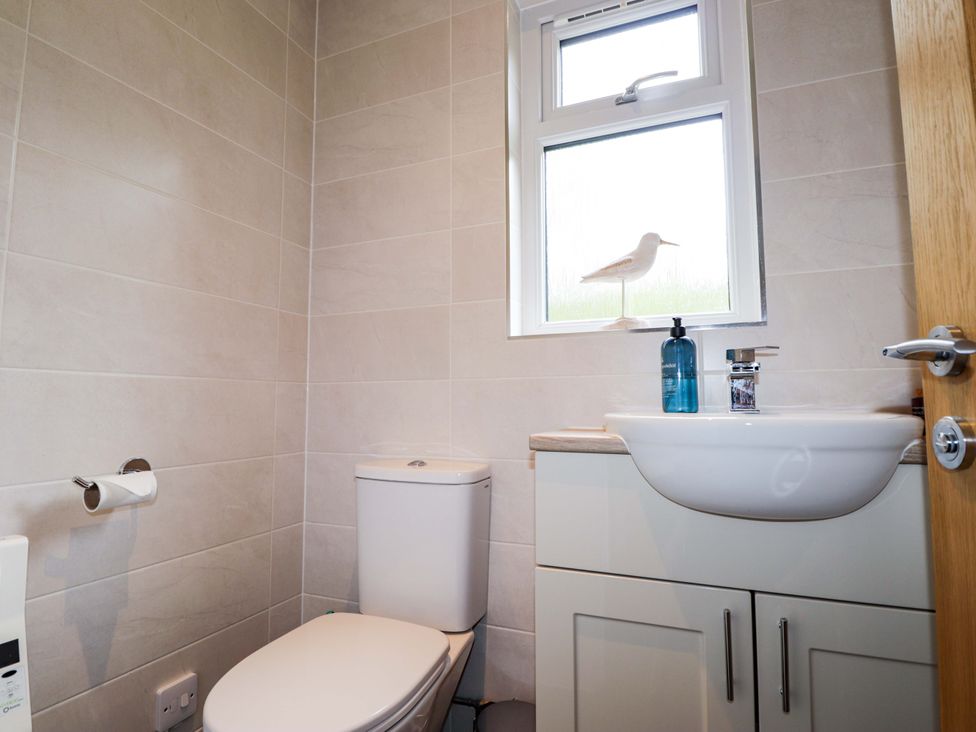 A bathroom with toilet and sink at 6 Carn Dearg in Aviemore