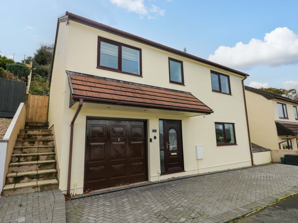 A house with a garage and front door at 15 Lawnswood in Saundersfoot