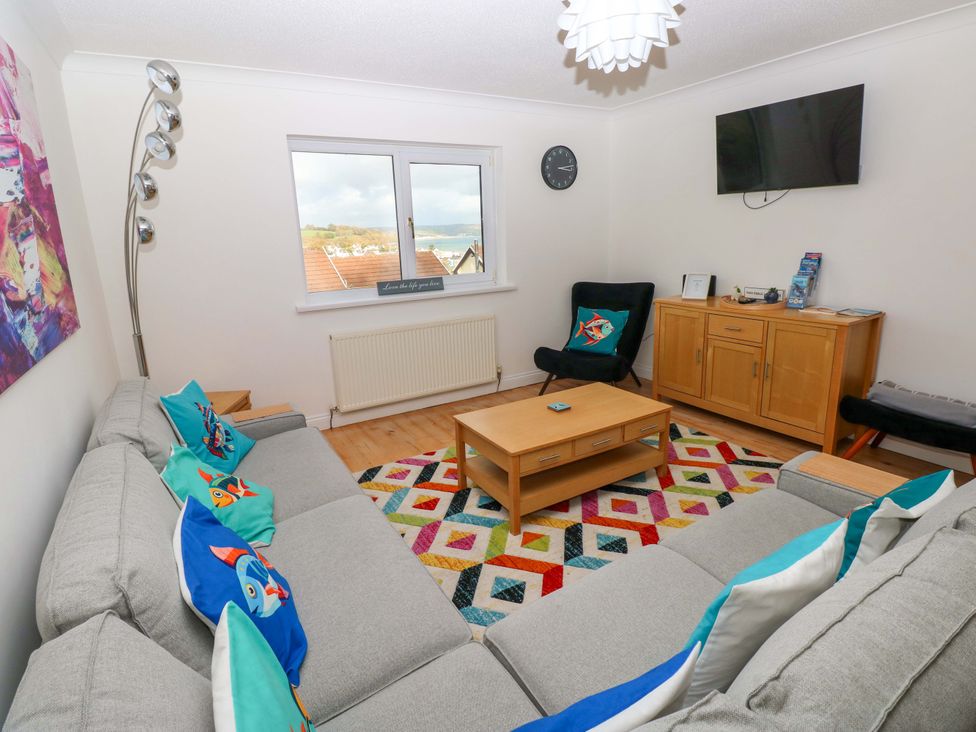 A living room with a sofa and coffee table at 15 Lawnswood Saundersfoot