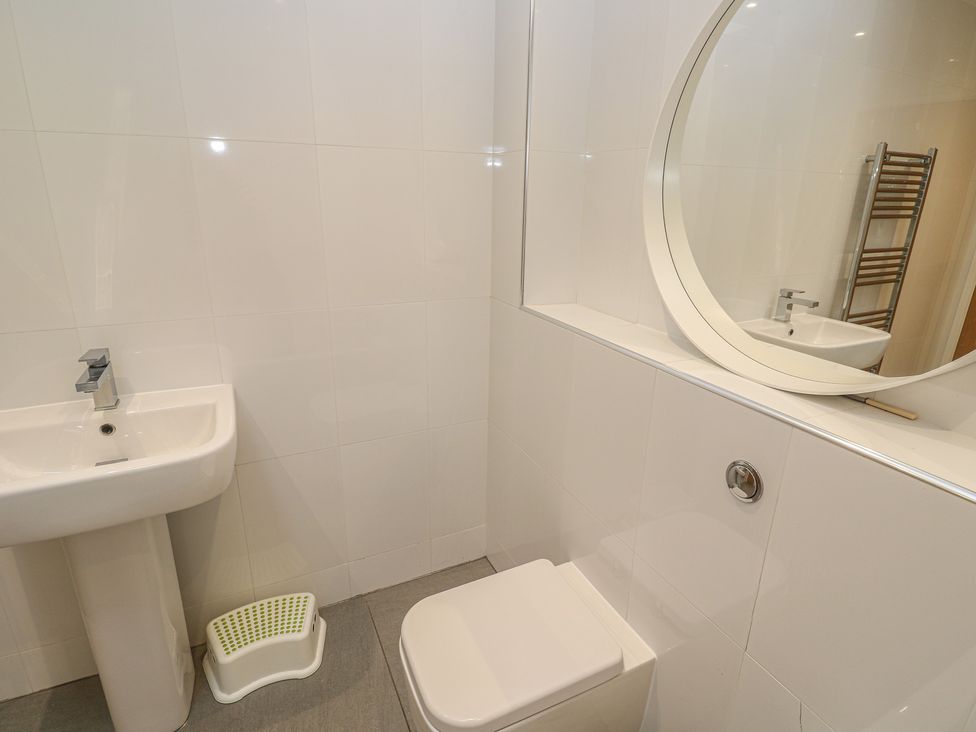 A bathroom with a sink and toilet at Chy Holly in Carbis Bay