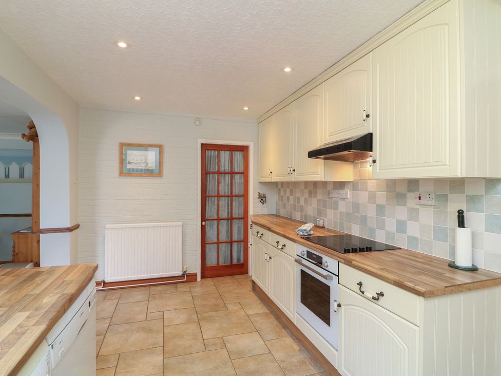 A kitchen with counter space and appliances at Larkspur Cottage in Alford