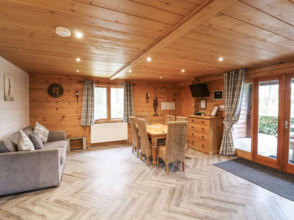 A dining room with a table and chairs at Willow in Dolton