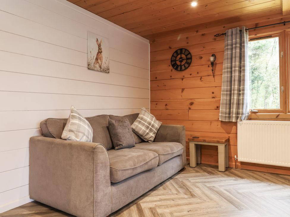 A living room with a sofa and a window at Willow in Dolton