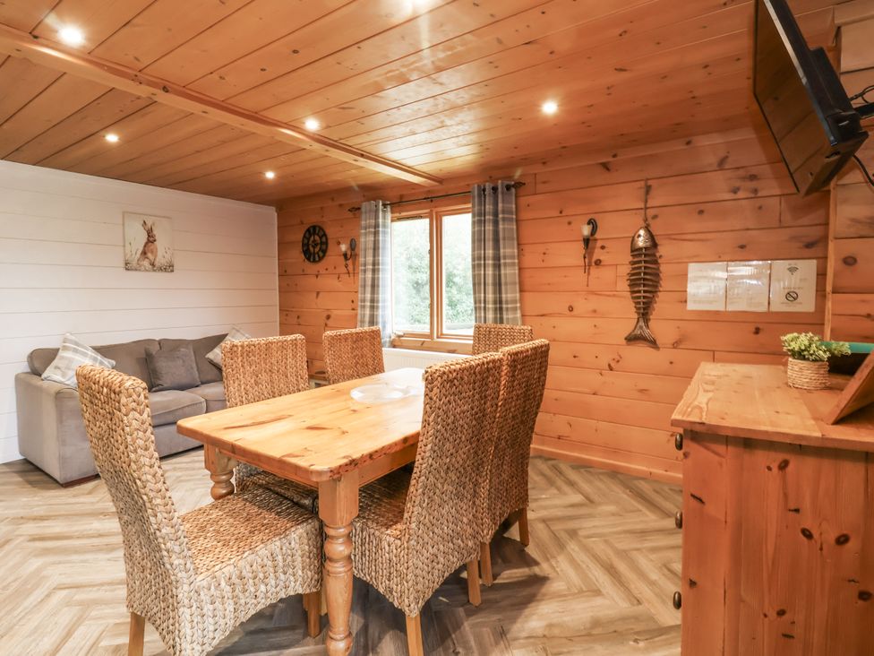 A dining room with a table and chairs at Willow in Dolton