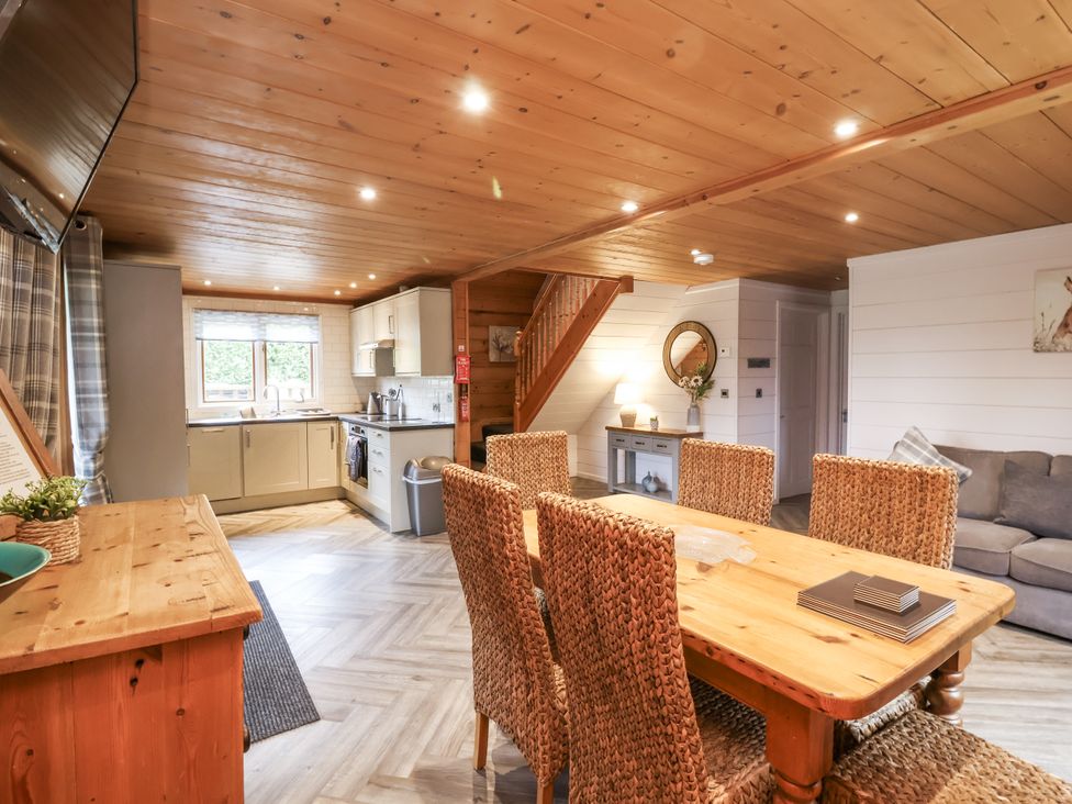A living room with dining area and kitchen at Willow in Dolton