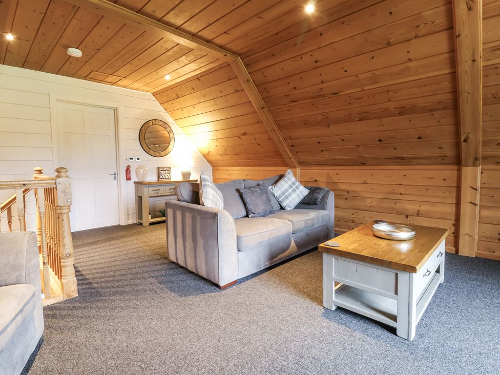 A living room with a sofa and coffee table at Willow in Dolton