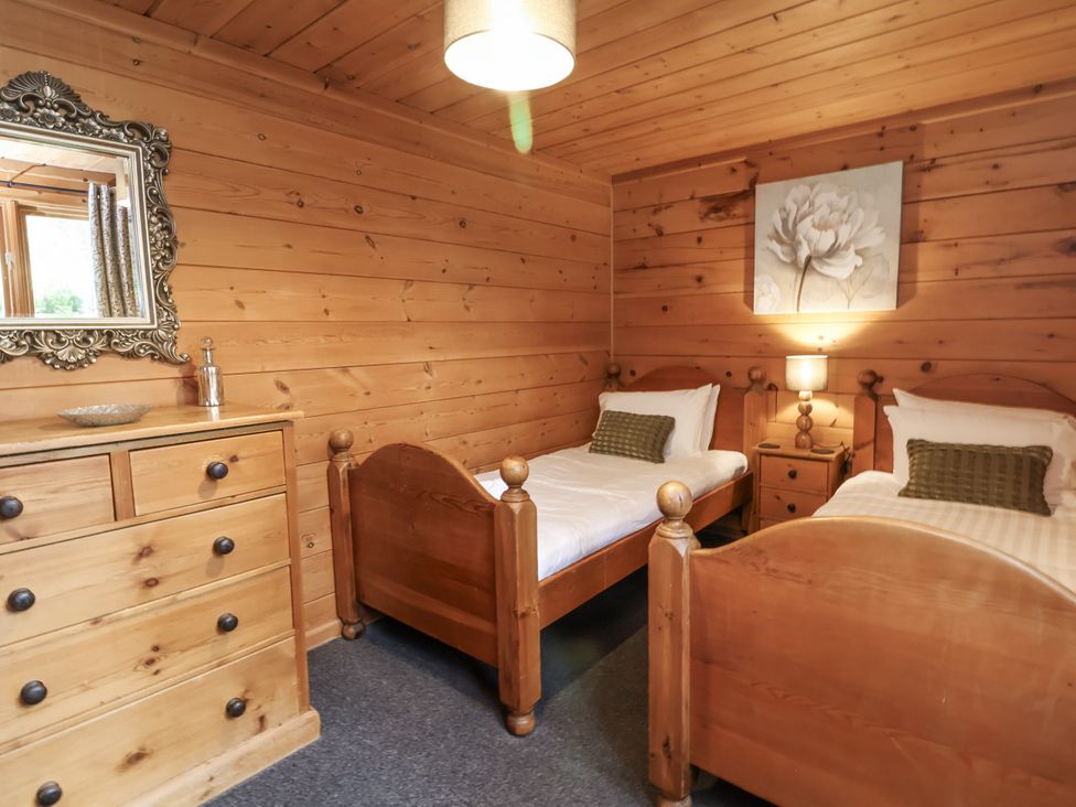 A bedroom with two beds and a dresser at Willow in Dolton