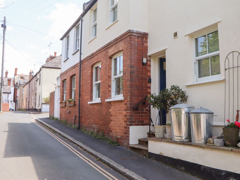 An outdoor area with a house and plant pots at 5 Exe Street Topsham