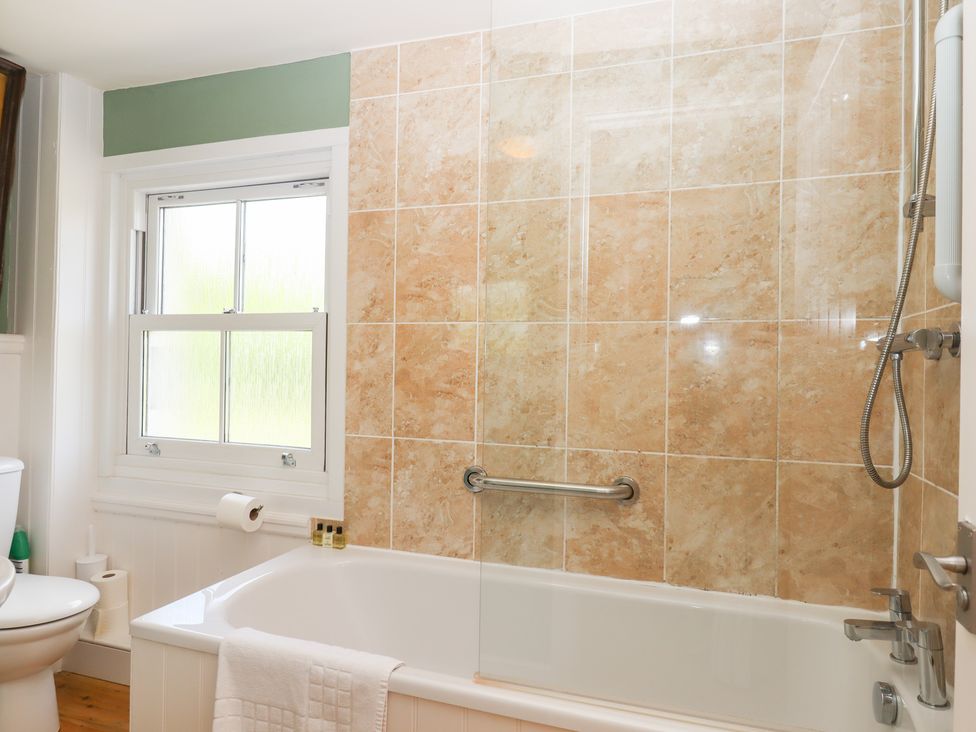 A bathroom featuring a bathtub and toilet at 5 Exe Street Topsham