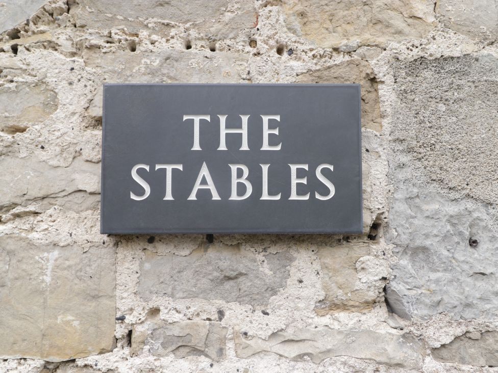 Sign on a stone wall at The Stables at Gileston Manor St Athan