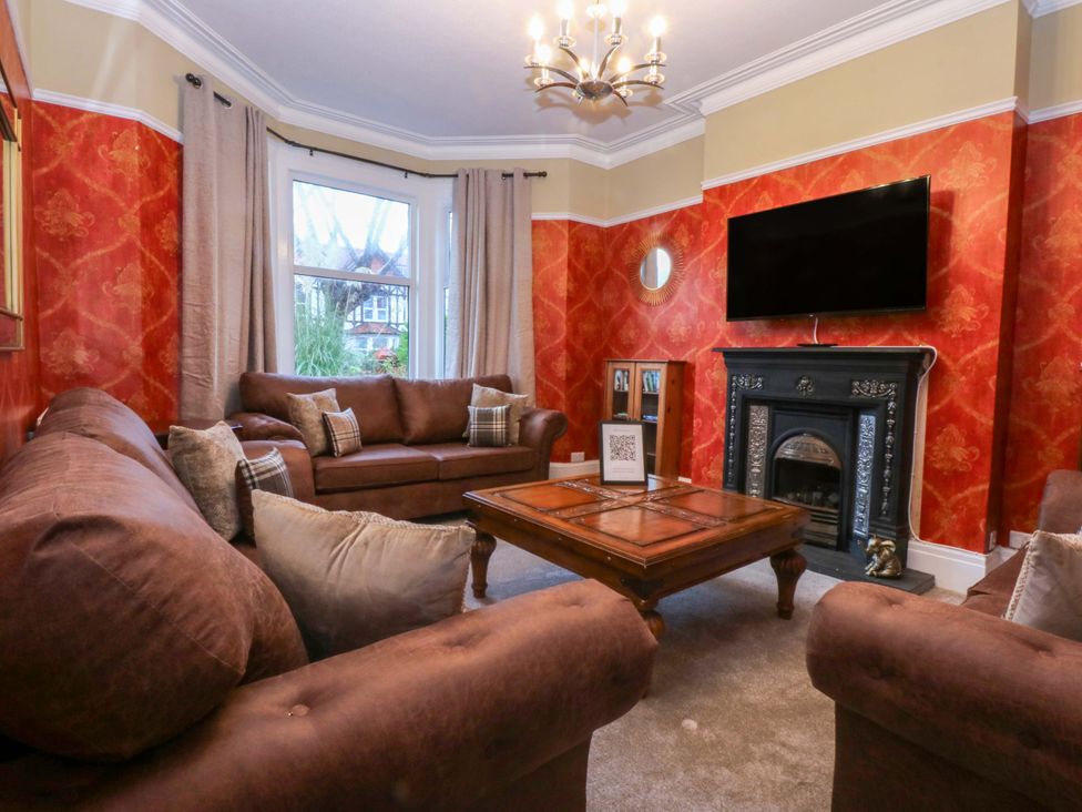 A living room with a sofa and coffee table at Southbourne Manor in Llandudno