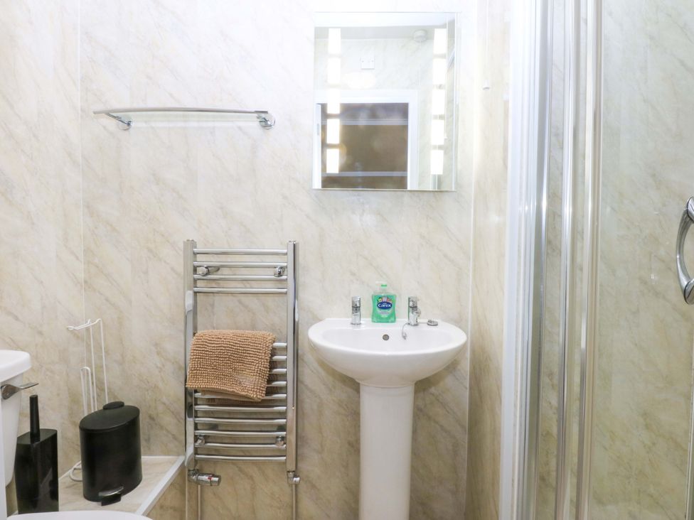 A bathroom with a sink and shower at Southbourne Manor in Llandudno