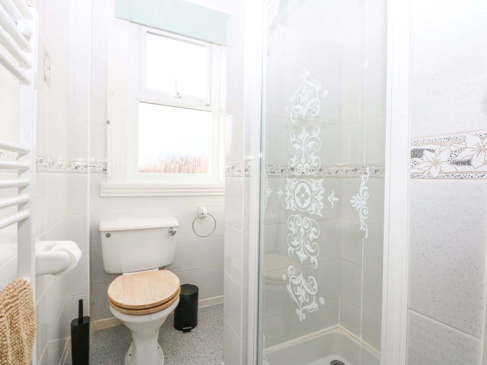 A bathroom with a shower and toilet at Southbourne Manor in Llandudno