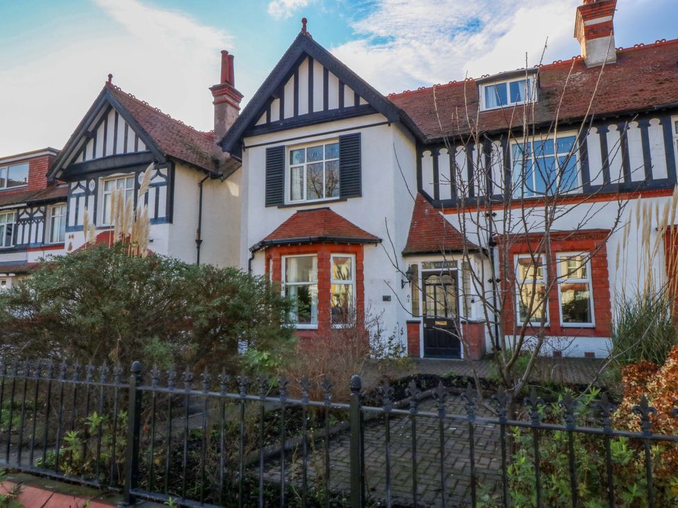 A house with a garden and fence at Southbourne Manor in Llandudno