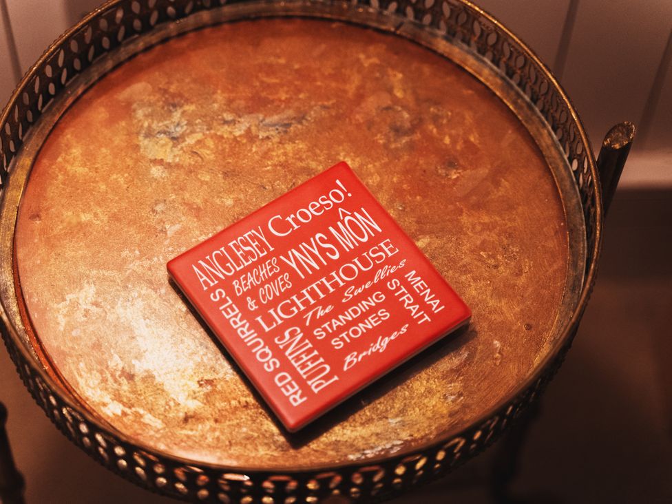 A coaster on a table at Glanllyn Bach in Llanfaelog