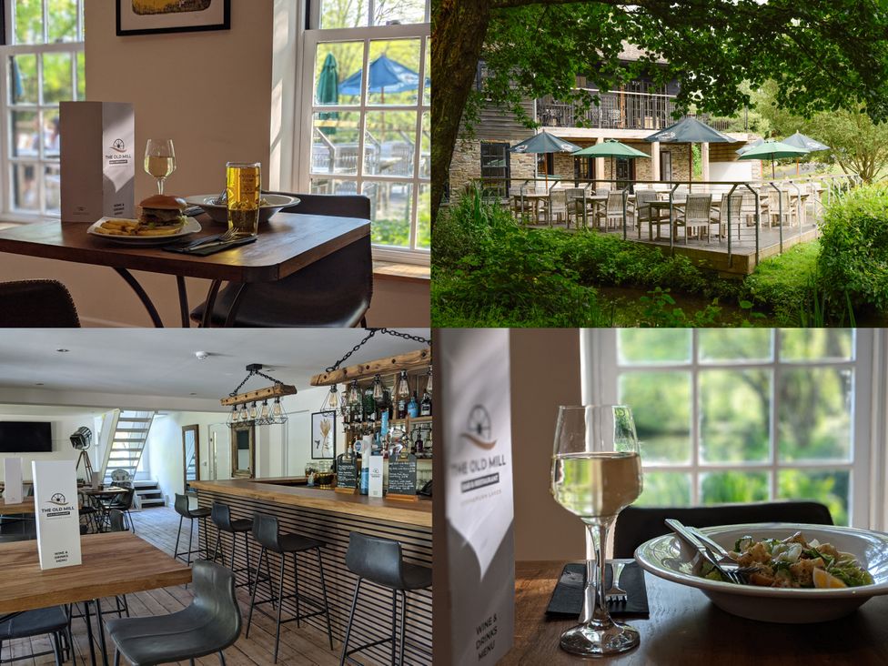 A restaurant with tables and chairs at The Old Mill in Lanreath near Looe