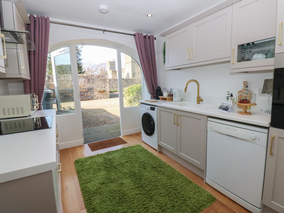 A kitchen with appliances and a window at The Cart House Snape near Bedale