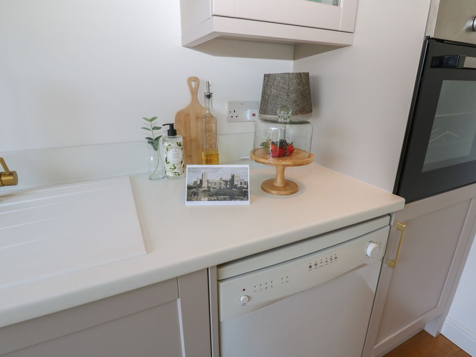 A kitchen counter with a sink, dishwasher, and various kitchen items at The Cart House in Snape near Bedale