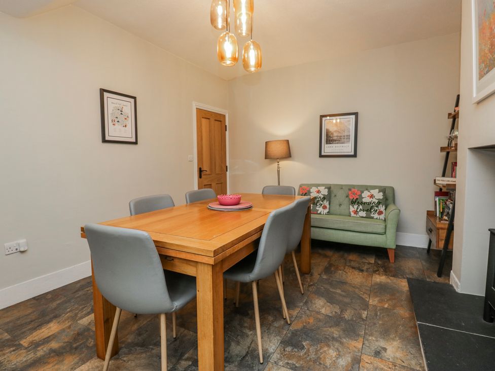 A dining room with a table and chairs at The Thistles Bowness-On-Windermere