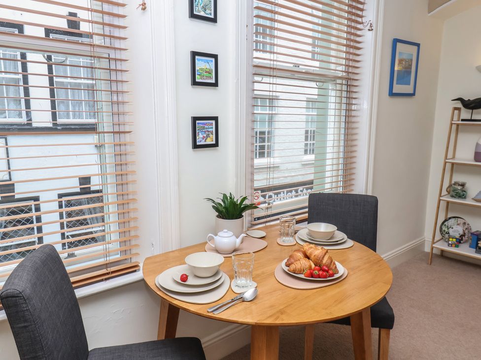 A dining room with a table set for breakfast at Jolly Roger in Whitby