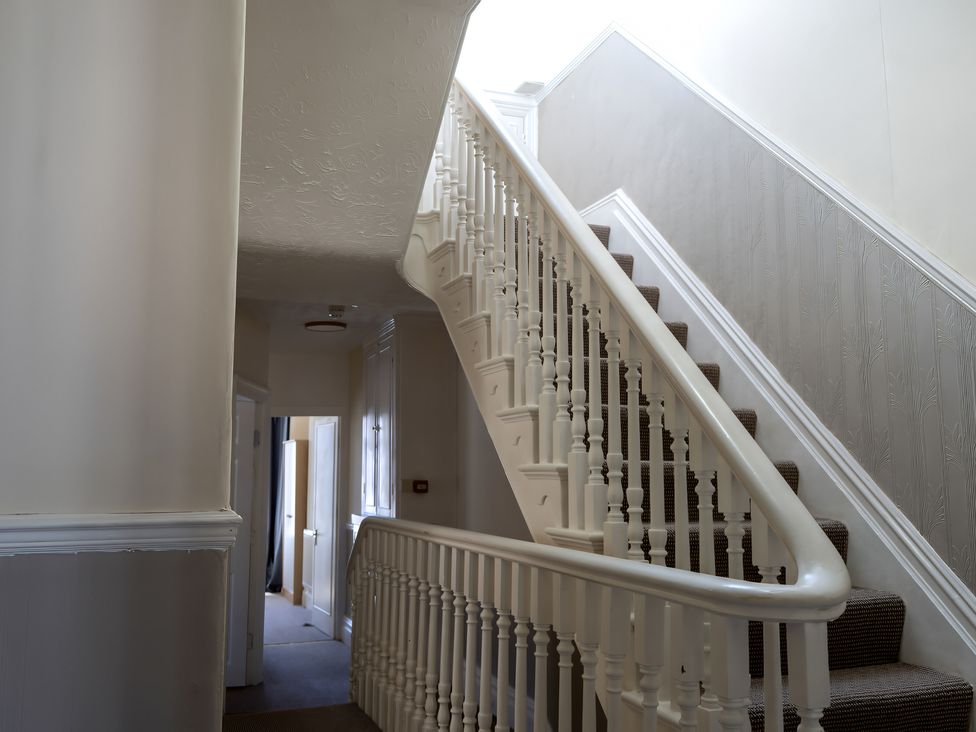A staircase in a hallway at Avalon Lodge in Bridlington