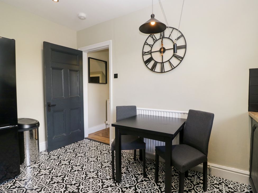 A dining room with a table and chairs at 5 Thornbarrow Road 