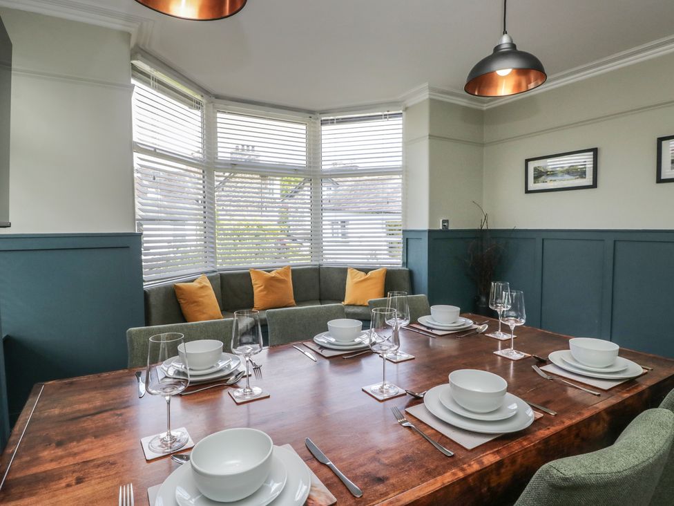 A dining room with a table set for meal at 5 Thornbarrow Road 
