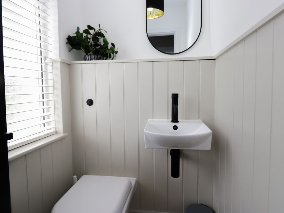A bathroom with a sink and toilet at 5 Thornbarrow Road 