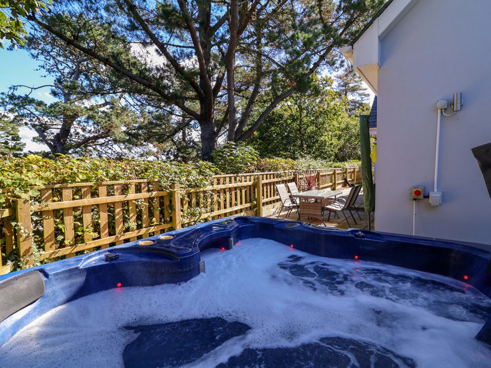 A hot tub with foam and decking area at Seagrass in Bideford