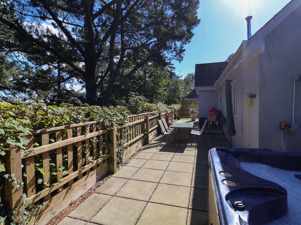 An outdoor patio with a table and chairs at Seagrass in Bideford